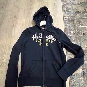Hollister Blue Zip-Up Hoodie with Camouflage Branding